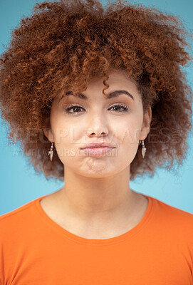 Buy stock photo Hair care, tired and portrait of a woman with an afro isolated on a blue background in a studio. Sad, stress and face of a frustrated girl with frizz, dry and problem with a hairstyle on a backdrop