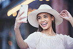 Woman, social media and smile for selfie in the city for vlogging, travel or profile picture and memories. Happy female influencer smiling for vlog, traveling or online 5G connection in an urban town