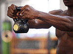 Kettlebell in black man hands, fitness in gym and weightlifting for strong arm muscle and bodybuilder training. Exercise for biceps, bodybuilding and strength with health and wellness of athlete