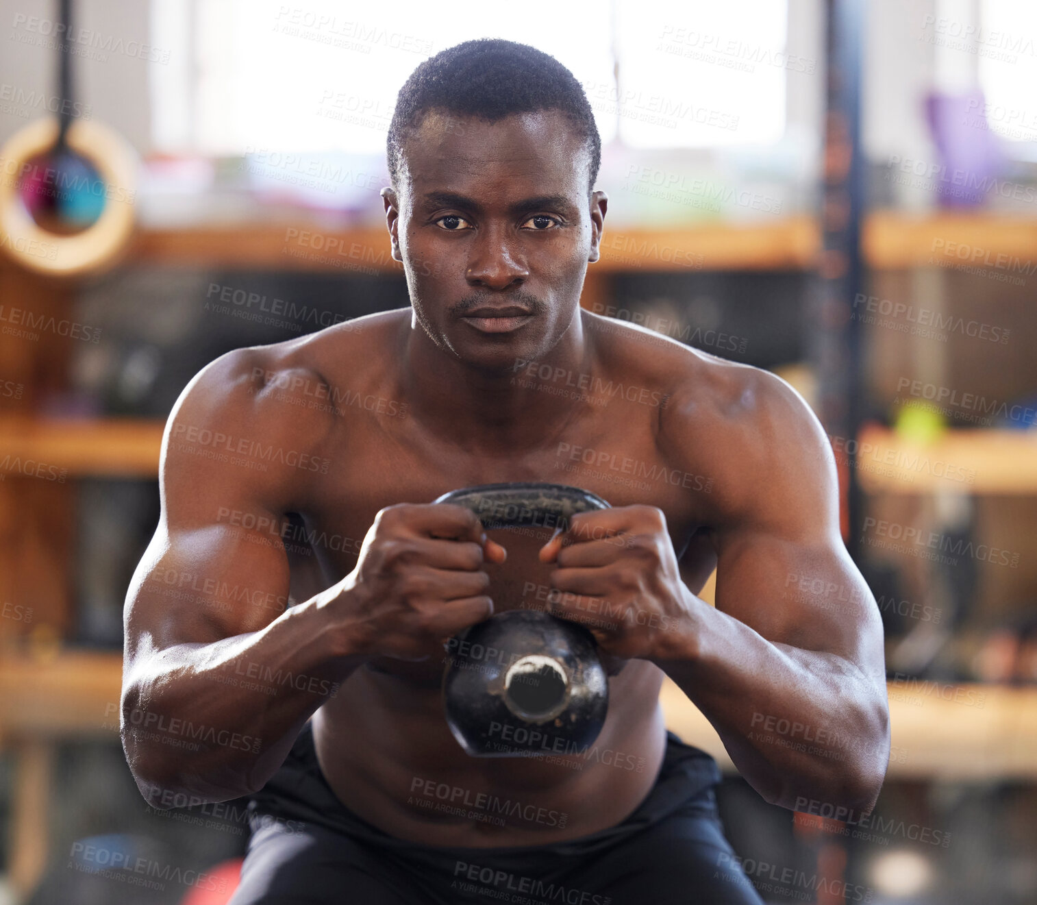 Buy stock photo Black man with kettlebell in gym, fitness and focus with arm muscle training, bodybuilder and weightlifting exercise. Biceps, strong and bodybuilding, power and serious with commitment to workout