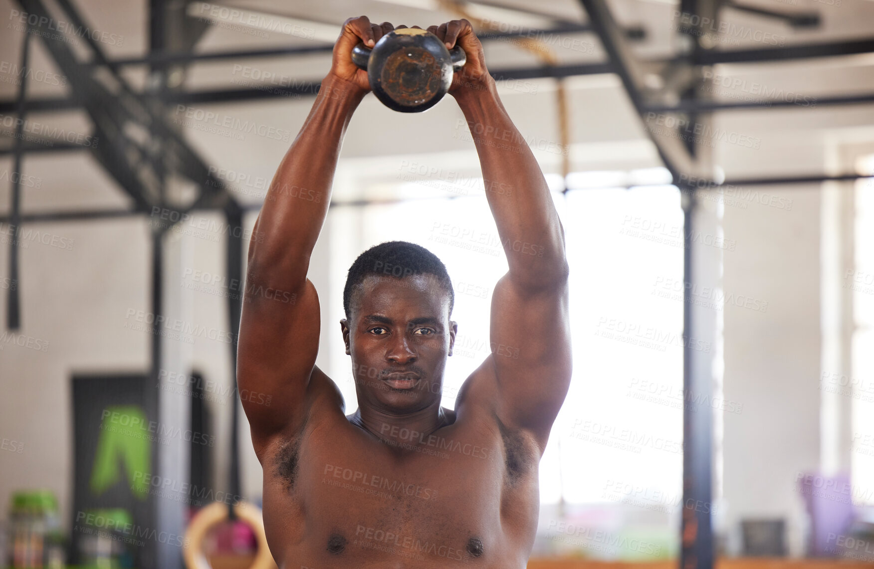 Buy stock photo Black man with kettlebell in gym, fitness and portrait with arm muscle training, bodybuilder and weightlifting exercise. Biceps, strong and bodybuilding, focus and serious with commitment to workout