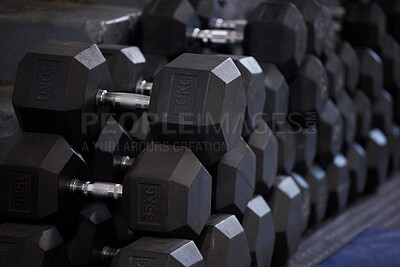 Buy stock photo Fitness, workout and dumbbells in empty gym for exercise, bodybuilding development and sports training club. Background zoom of heavy steel weights, equipment and iron for lifting in wellness studio