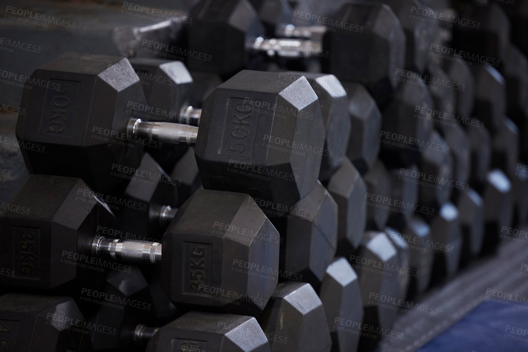 Buy stock photo Fitness, workout and dumbbells in empty gym for exercise, bodybuilding development and sports training club. Background zoom of heavy steel weights, equipment and iron for lifting in wellness studio