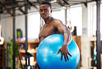 Black man, exercise ball and gym portrait for fitness, exercise and workout. Sports or athlete person training for health and wellness or strong power, energy and bodybuilder muscle growth goals