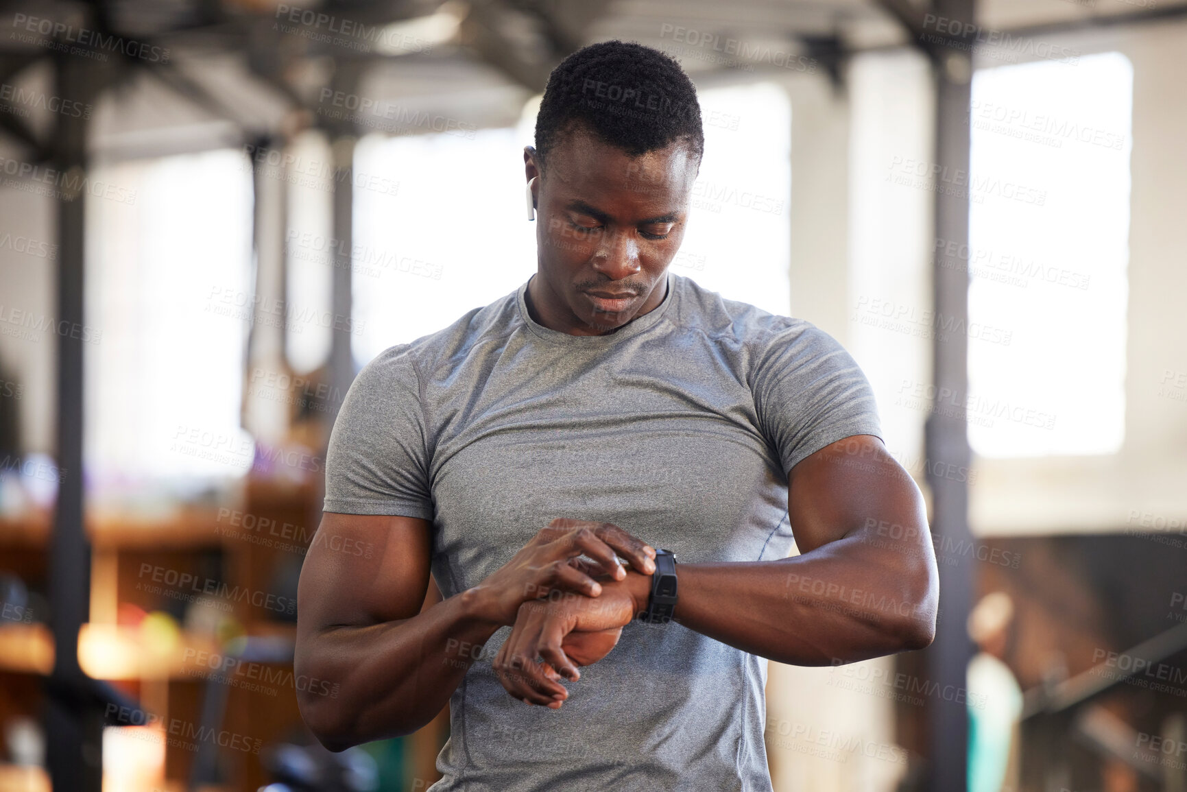 Buy stock photo Fitness, smartwatch and black man in gym for training, workout or exercise results, monitor or progress update, Check, timer and bodybuilder athlete or sports person technology in health and wellness