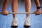 Barbell, hands and woman exercise on floor for fitness, workout and sports challenge in gym. Closeup female athlete, bodybuilder and heavy weights on ground for deadlift, wellness and muscle power