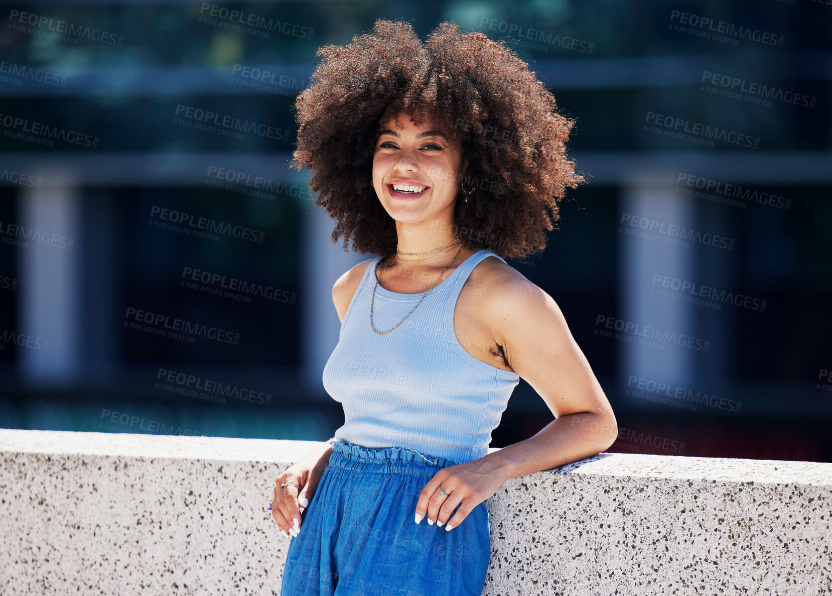 Buy stock photo Portrait, fashion and city with a black woman outdoor on a bridge, looking relaxed during a summer day. Street, style or urban and an attractive young female posing outside with an afro hairstyle