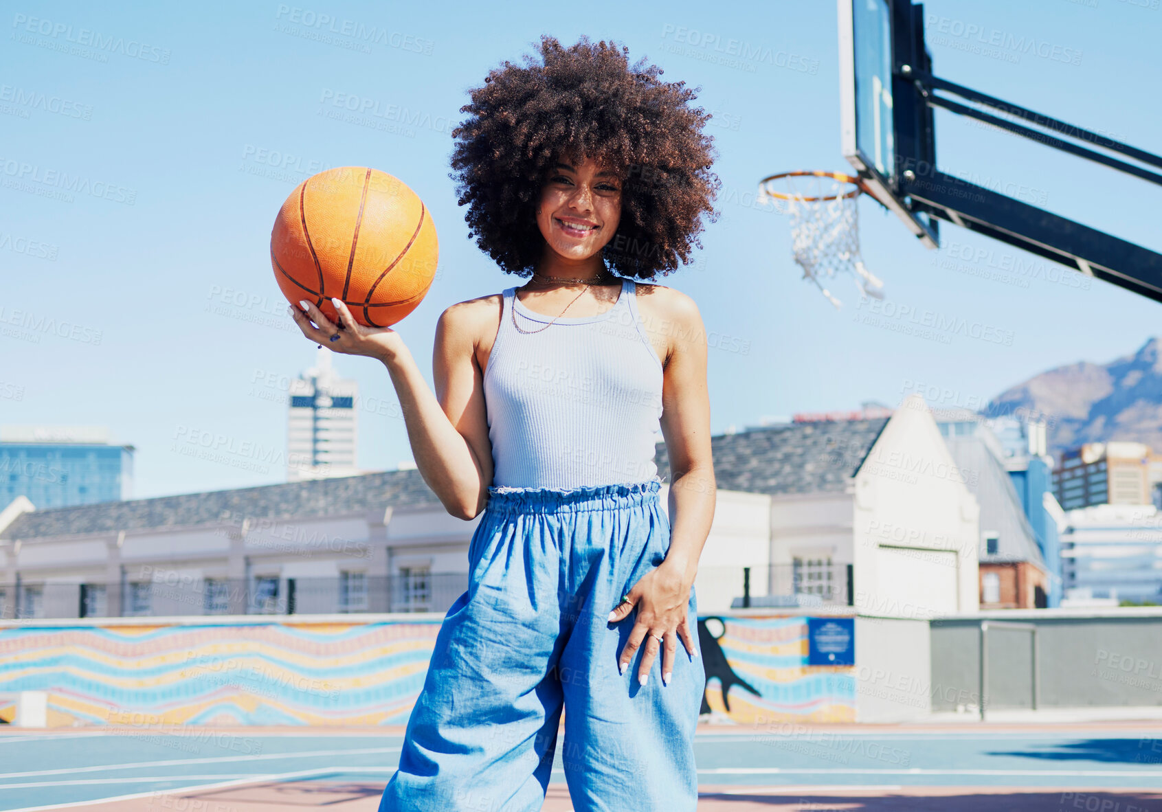 Buy stock photo Basketball court, city and portrait of black woman with smile in trendy, urban style and edgy clothes. Sports, fitness park and girl model outdoors with ball with confidence, happy and cool outfit