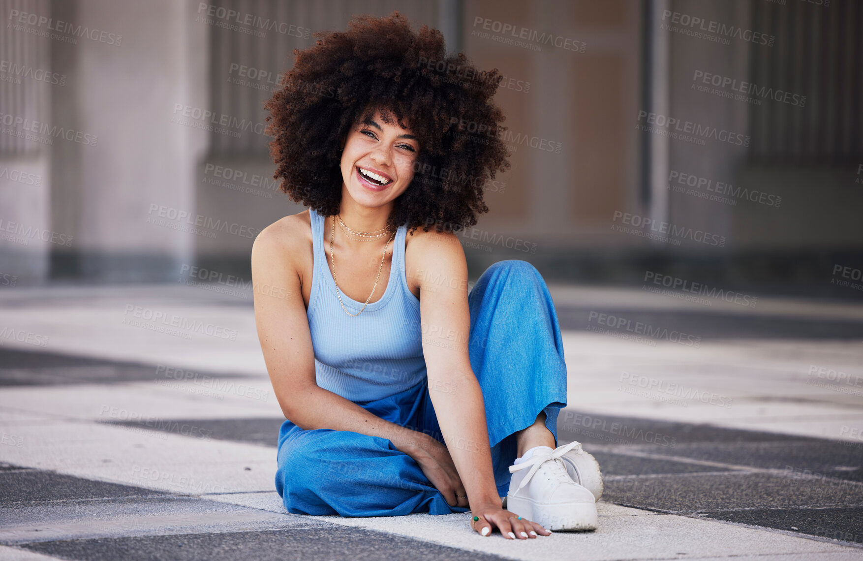 Buy stock photo Fashion, city and portrait of black woman on floor with trendy style, cool outfit and stylish clothes. Beauty, smile and happy girl sitting in urban building with confidence, happy attitude and pose