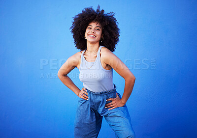 Buy stock photo Fashion, natural hair and black woman isolated on a blue background for gen z, youth or cool portrait with mockup. Afro person or beautiful model with style, confidence and happy in studio space