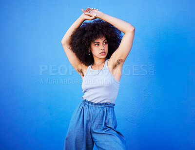Buy stock photo Body positivity, empowerment and confident woman with hair isolated on a blue background. Beauty, natural and African girl showing armpit with confidence, feminism and attractive on a backdrop