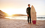 Surfer, portrait and man with surfboard at the sea, beach and ocean in sunset or the morning with mockup space. Young, ready and male in swimsuit on a sunny surf day on the sand, shore and water