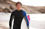 Fitness, surfing and portrait of a man at the beach for water sports, happiness and holiday in Bali. Smile, training and surfer with a board for exercise, ocean break and activity on a vacation