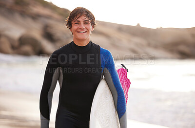 Fitness, surfing and portrait of a man at the beach for water sports, happiness and holiday in Bali. Smile, training and surfer with a board for exercise, ocean break and activity on a vacation