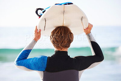 Buy stock photo Surfing, sports and man by sea for fitness, exercise or training and walking to ocean water. Surfboard and super, person or rear of professional athlete with wellness, health and beach waves activity