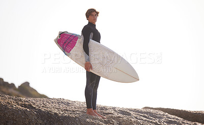 Buy stock photo Surfing, man with surfboard for sports outdoor, beach rocks and travel with mockup space and nature. Adventure, extreme sports and surfer portrait, active lifestyle with surf training in Australia