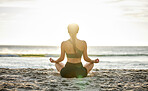 Woman, yoga and meditation on the beach sunset for spiritual wellness, zen or workout in the outdoors. Female yogi relaxing and meditating for calm, peaceful mind or awareness by the ocean coast 