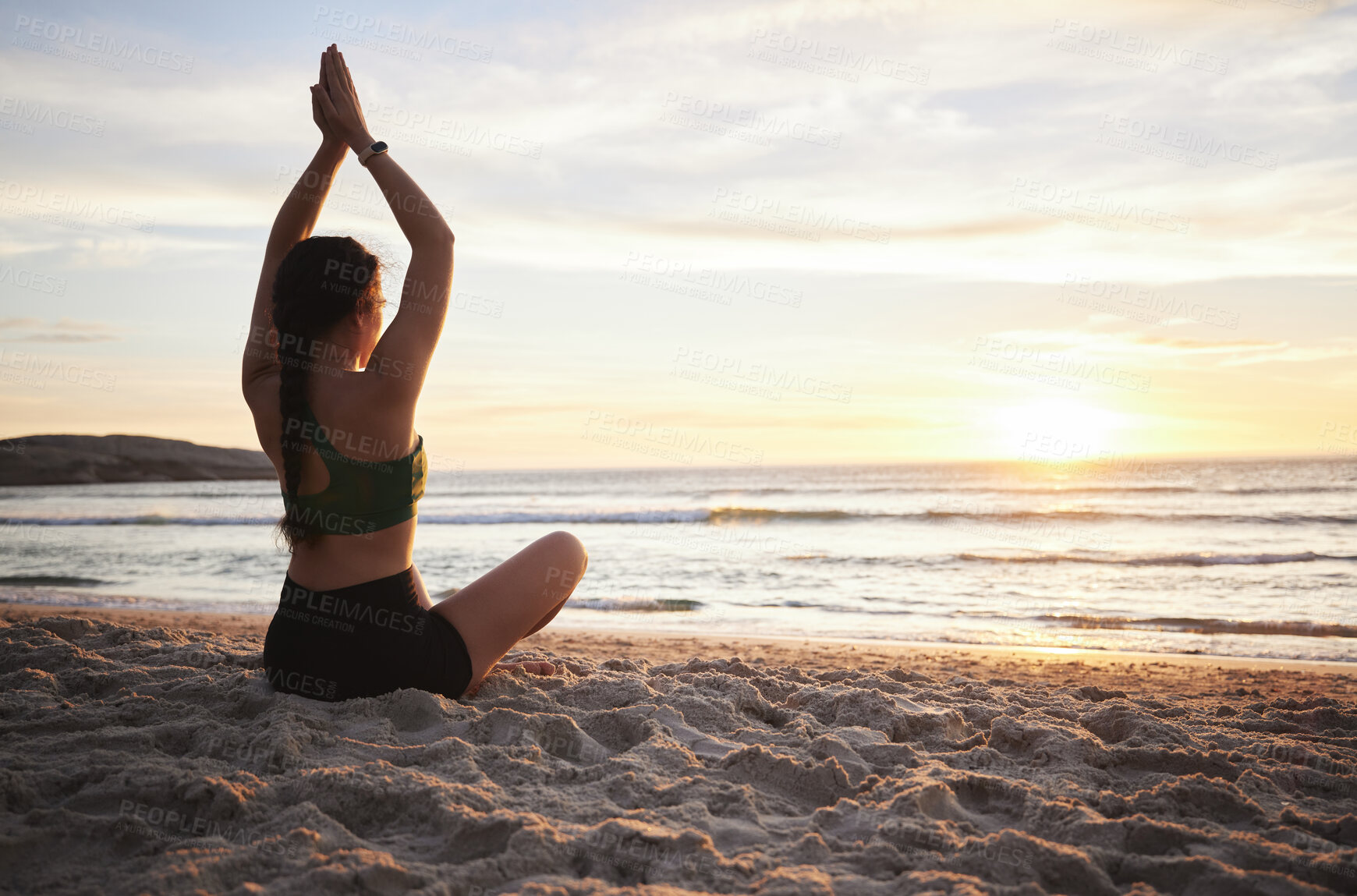 Buy stock photo Woman, yoga and meditation on the beach in sunset for spiritual wellness or zen workout outdoors. Female yogi relaxing or meditating in sunrise for calm, peaceful mind or awareness by the ocean coast