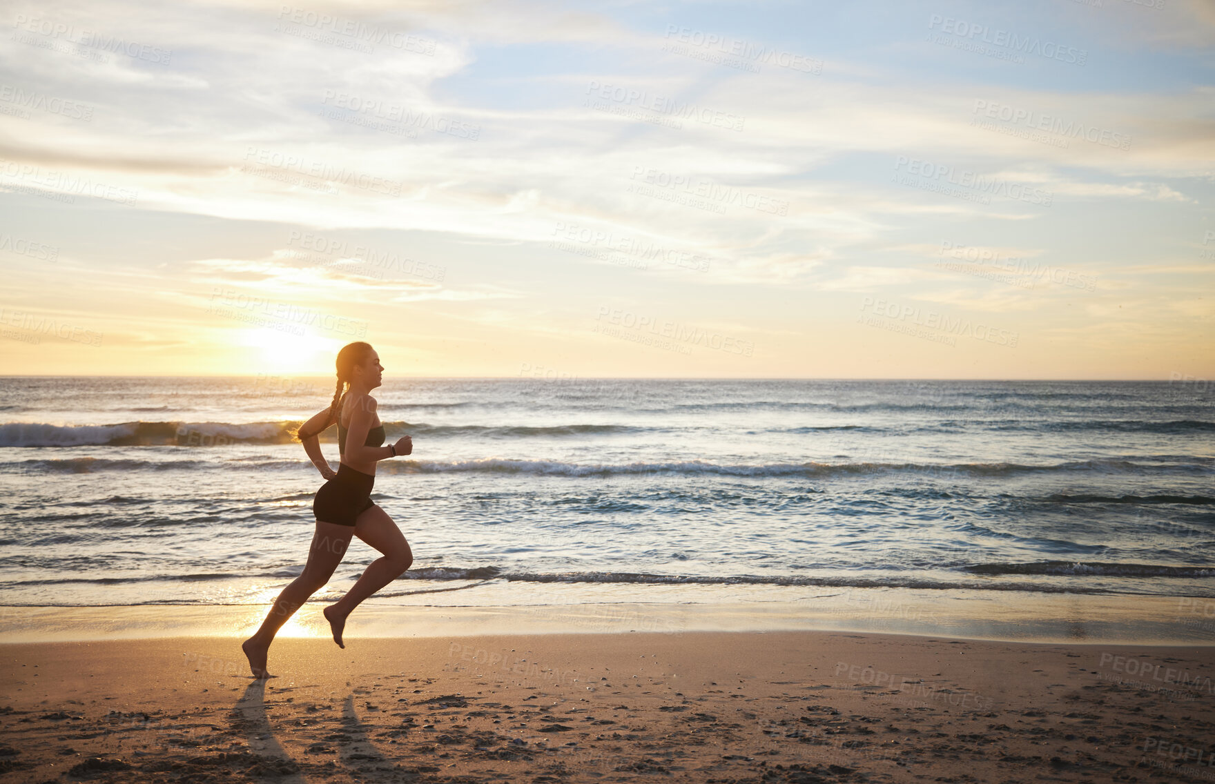Buy stock photo Woman, fitness and running on the beach in sunset for healthy cardio exercise, training or workout on mockup. Female runner exercising in sunrise for run, health and wellness by the ocean coast