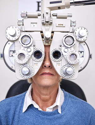 Buy stock photo Senior woman patient, eye test and phoropter in hospital, optometrist office or clinic for vision healthcare. Optician tools, elderly lady or medical lens device for customer, client or consumer eyes