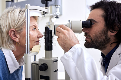 Buy stock photo Optometry, machine exam and woman with an optometrist for a vision check, eye consultation and test. Healthcare, help and male optician with a senior patient to measure visual eyesight with equipment