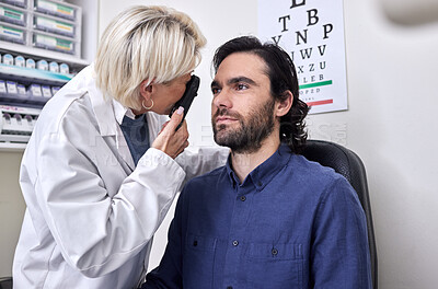 Buy stock photo Doctor with a man in a vision test or eye exam for eyesight by doctor, optometrist or ophthalmologist with medical aid. Patient or client with a helpful senior optician to see or check glaucoma 
