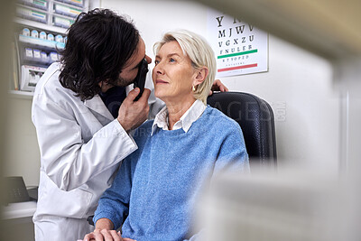 Buy stock photo Senior patient in a vision test or eye exam for eyesight by doctor, optometrist or ophthalmologist with medical aid.  Mature woman or client with a helpful optician to see retina or check glaucoma 