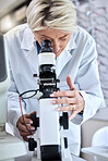 ophthalmology, microscope and glasses with a woman doctor with tools to check lens for eye care. Medical person at work for science, vision and health insurance while working in  lab, store or clinic