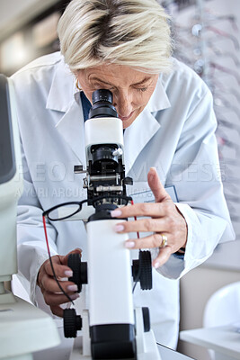 Buy stock photo ophthalmology, microscope and glasses with a woman doctor with tools to check lens for eye care. Medical person at work for science, vision and health insurance while working in  lab, store or clinic