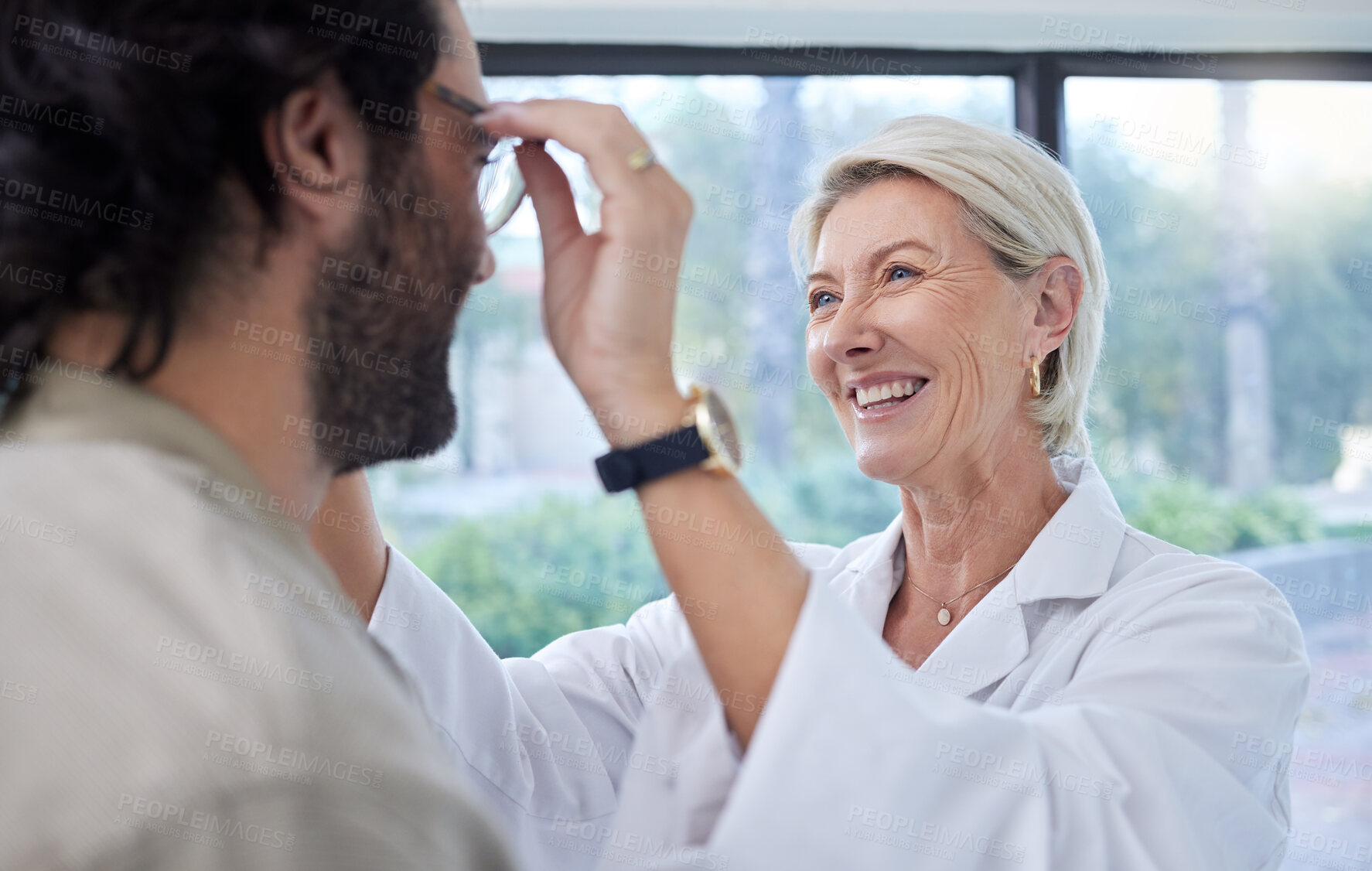 Buy stock photo Optometrist, woman and helping customer, eye and glasses in store for vision, eyesight or lenses. Face of happy optician, new frames and consulting services in retail shop, analysis and clinic choice