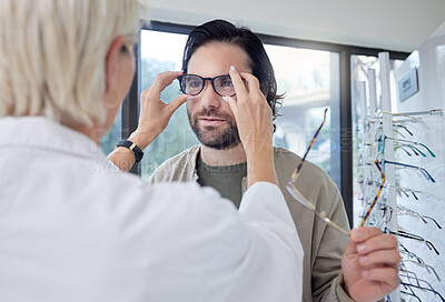 Buy stock photo Optometrist, glasses and man in store for choice of frames, eyesight and vision. Customer face, new spectacles and eye care test for prescription assessment, clinic consulting or retail shop services