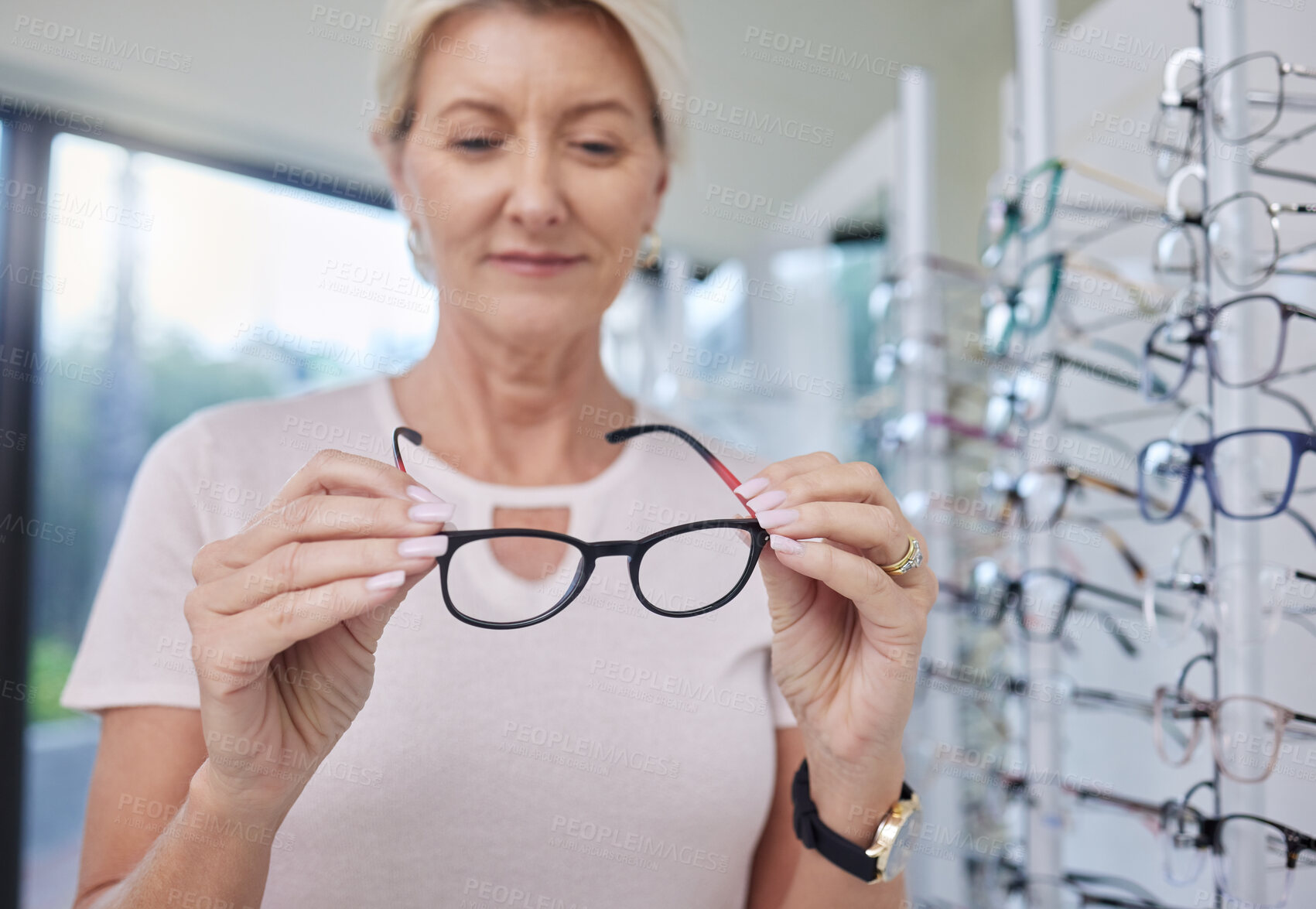 Buy stock photo Woman customer, glasses and eye care shopping for lens or frame for vision wellness with optometry. Happy senior person with choice or decision for retail sale with health insurance at optics store