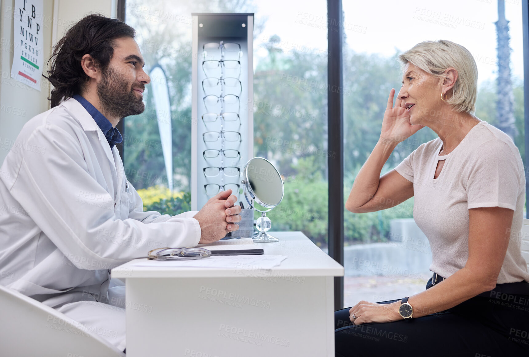 Buy stock photo Eye doctor, senior or woman consulting for eyesight advice at optometrist or ophthalmologist with medical aid. Customer talking or asking questions to check vision health with a trusted optician 