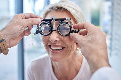 Buy stock photo Happy customer in a vision test or eye exam for eyesight by doctor, optometrist or ophthalmologist with medical aid. Hands, helpful or optician consulting a senior woman to see or check glaucoma