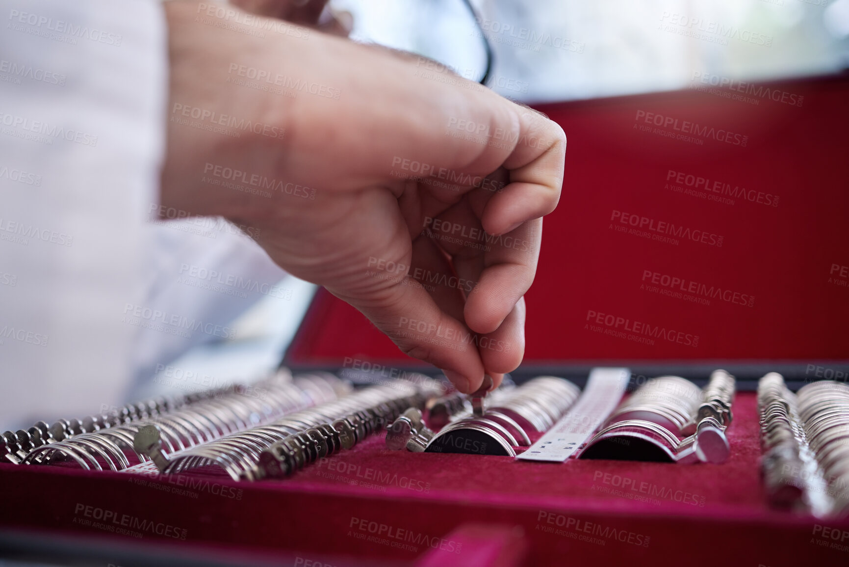 Buy stock photo Optometry, test lens kit and hand of a optometrist preparing for a eye exam in a optical health clinic. Vision, diopter glasses and eyecare doctor or oculist fixing prescription lenses in optic store