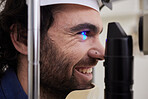 Eye exam, test or care for patient with laser machine at optometry consultation for lens or frame for vision. Face of happy man with industry tools for eyes, eyesight and check with health insurance