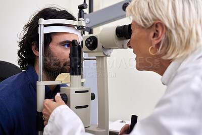 Buy stock photo Patient, eye exam or test for vision with laser lens and doctor at optometry consultation. Man and woman healthcare person with machine for eyes, wellness and health insurance with expert care