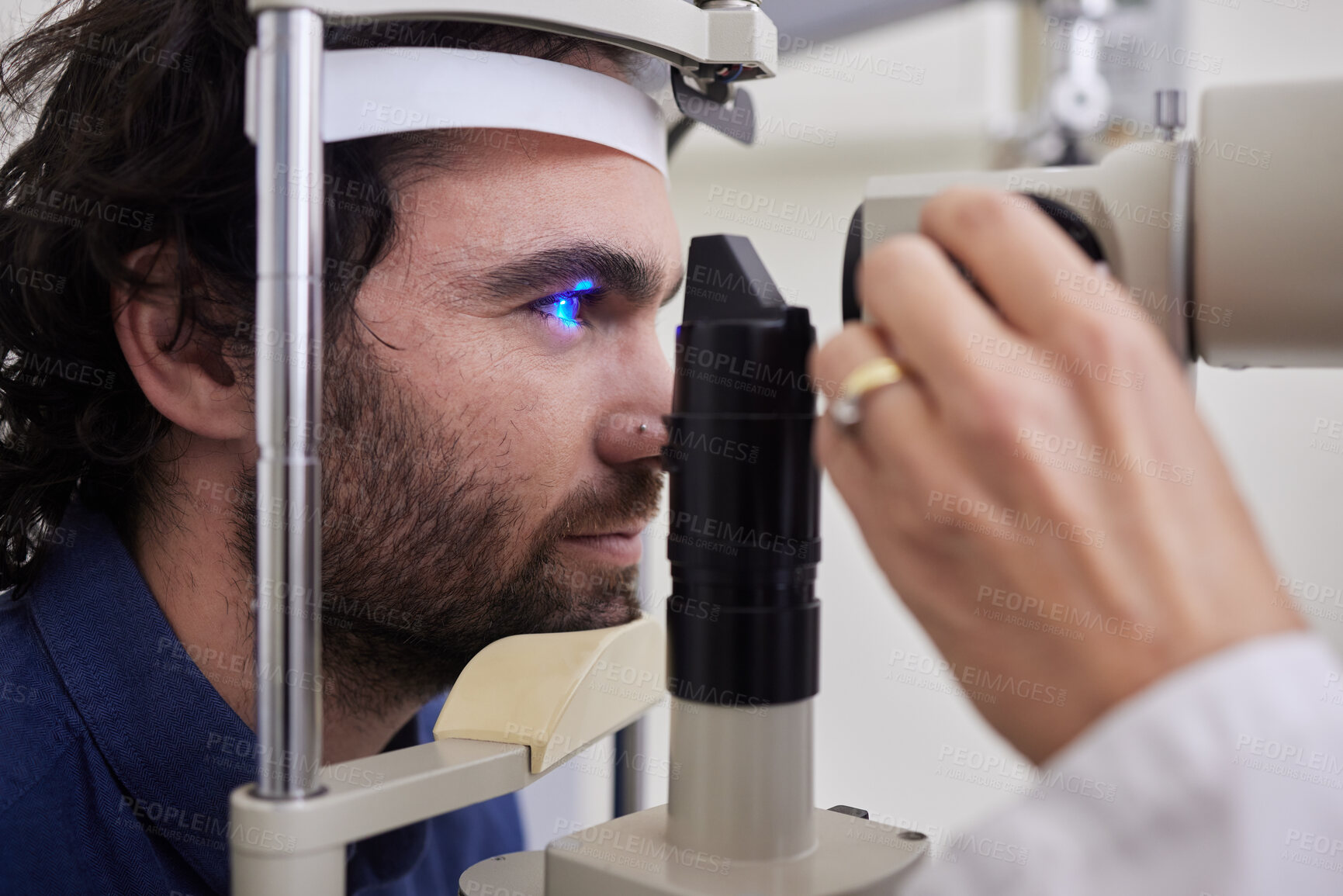 Buy stock photo Eye exam, care or laser test for patient with machine at optometry consultation for lens or vision. Face of man and doctor hands for eyes, eyesight and check with health insurance for wellness