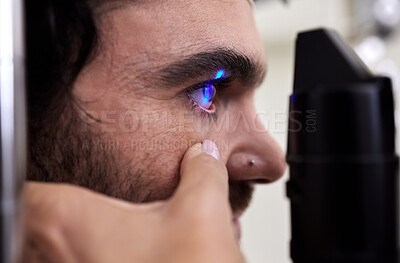 Buy stock photo Eye exam, vision or laser test for patient with machine at optometry consultation for retina problem. Hands, eyesight or doctor helping or checking a man or client with health insurance for wellness