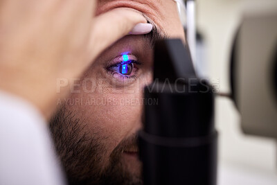 Buy stock photo Eye exam, vision or laser test for a man with machine at optometry consultation for retina problem. Hands, eyesight or doctor helping or checking a patient or client with medical insurance for health