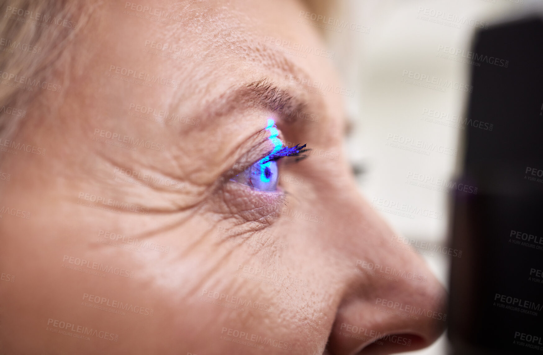 Buy stock photo Eye exam, vision or laser test for an old woman with a machine at optometry consultation for retina problem. Senior, patient or client with medical health insurance checking eyesight at optician