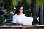 Cafe, working and woman typing on laptop for online project, email or sales proposal. Freelancer, remote worker or happy female with digital computer for writing, networking or planning at restaurant