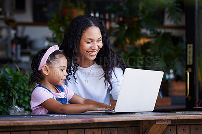 Buy stock photo Mother, learning and girl with laptop at cafe for education and development online. Family, remote worker and happy woman teaching kid how to type on computer at restaurant, bonding and having fun.