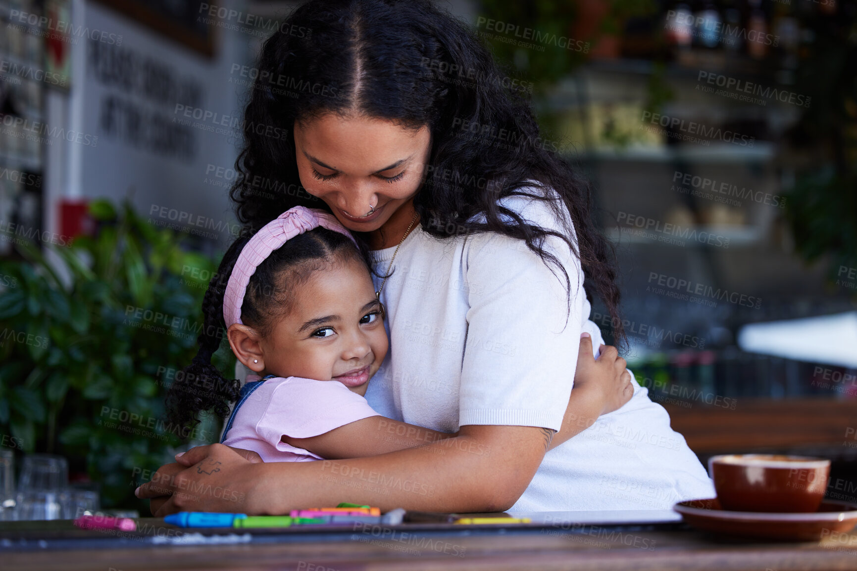 Buy stock photo Love, mother and hug girl at cafe, bonding and enjoying quality time together. Portrait, family care and mama hugging, cuddle or embrace with happy daughter, kid or child, smiling and having fun.