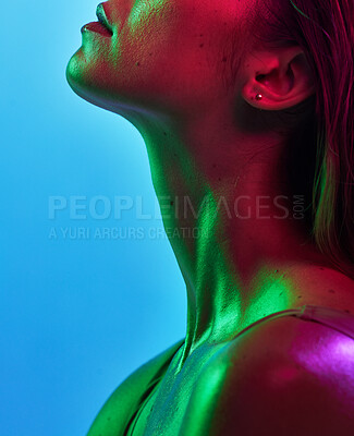 Buy stock photo Woman neck, skincare or neon lighting on isolated blue background in trendy, cool or stylish fantasy art in studio. Zoom, beauty or model body glow in creative aesthetic, green or pink lights texture