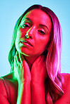 Woman skincare, portrait or neon lighting on isolated blue background for trendy studio fashion or cool style. Beauty model, face or creative aesthetic art and green, pink lights or makeup cosmetics