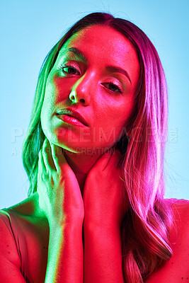 Buy stock photo Woman skincare, portrait or neon lighting on isolated blue background for trendy studio fashion or cool style. Beauty model, face or creative aesthetic art and green, pink lights or makeup cosmetics