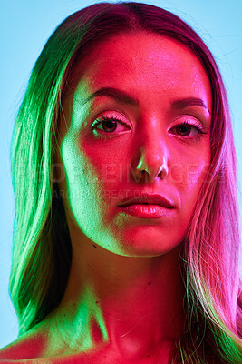 Buy stock photo Portrait, skincare or glowing neon lighting on isolated blue background or studio fashion spotlight. Zoom, beauty model or woman face in creative fantasy green, pink or lights art aesthetic in makeup