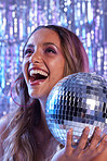 disco ball, woman and happiness of a female at a party or celebration at a night club. Excited, glitter and happy young person face with a smile and makeup feeling young with blurred background
