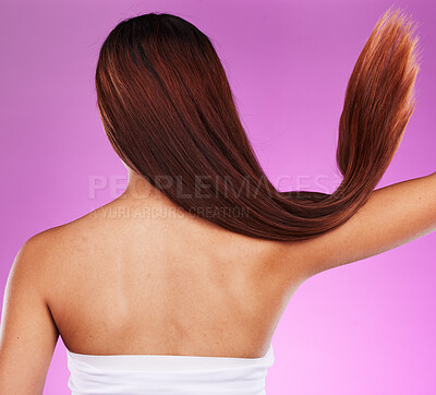 Buy stock photo Back, woman and hair motion in studio with color dye, beauty and salon shampoo. Behind long hairstyle, cosmetics and clean textures of model for shine, growth and aesthetic wellness of healthy scalp